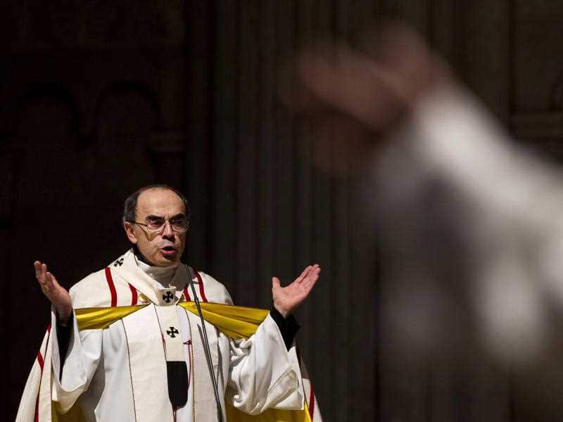The cardinal leads a mass for migrants in the Saint-Jean Cathedral, in Lyon.