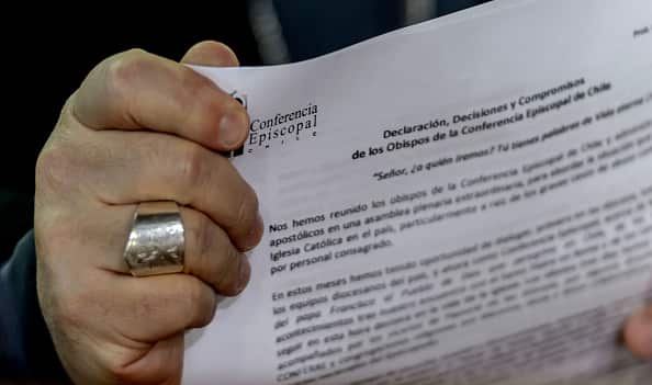 Monsignor Fernando Ramos, holds the apology  during a press conference in Punta de Tralca, west of Santiago.