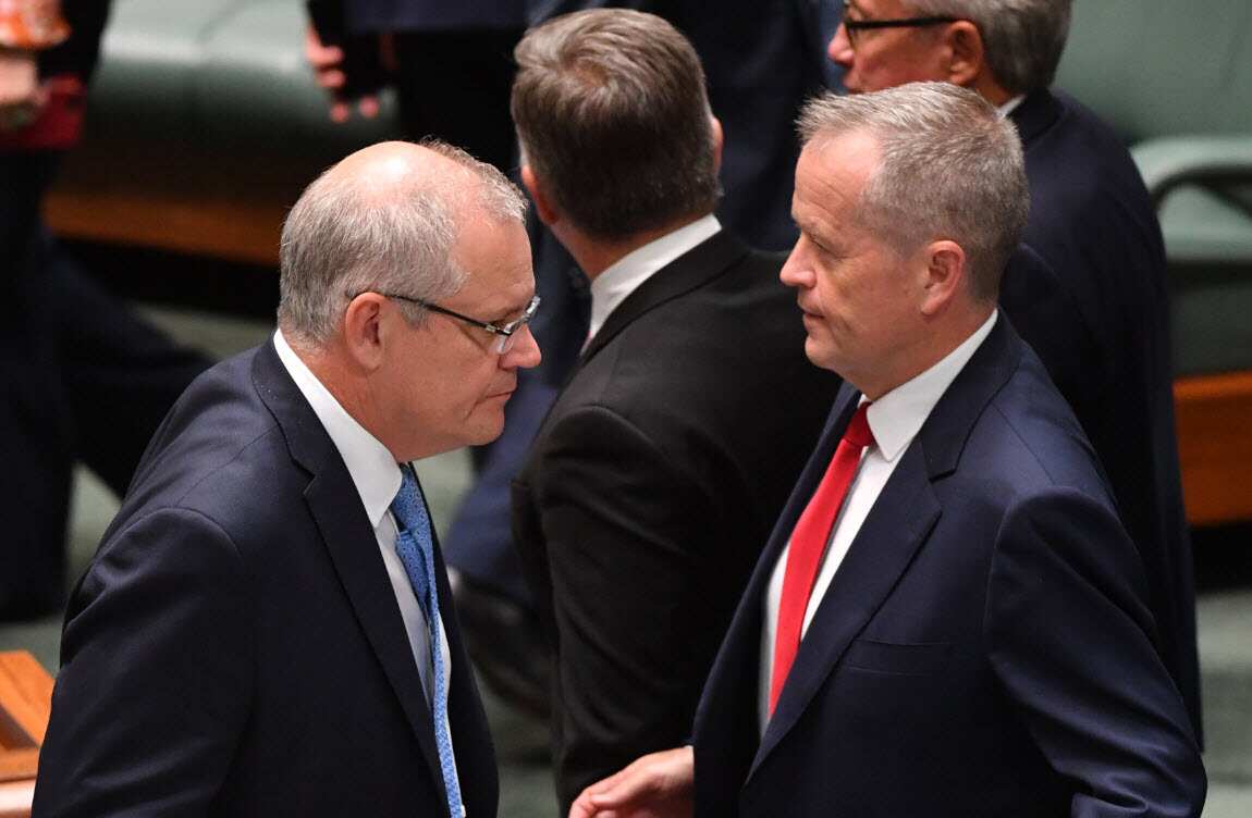 Prime Minister Scott Morrison and Leader of the Opposition Bill Shorten during division in the House of Representatives at Parliament House in Canberra (AAP)