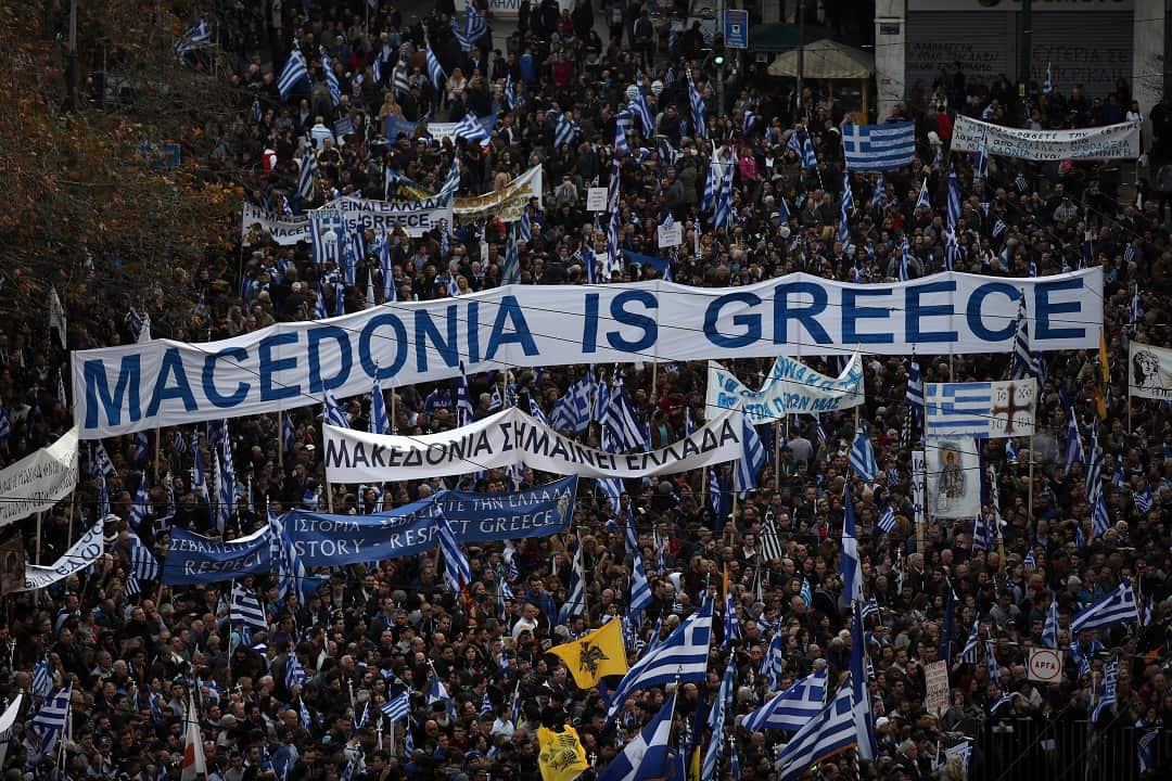 Protesters from across Greece converge in Athens' main square outside parliament to protest a potential Greek compromise.