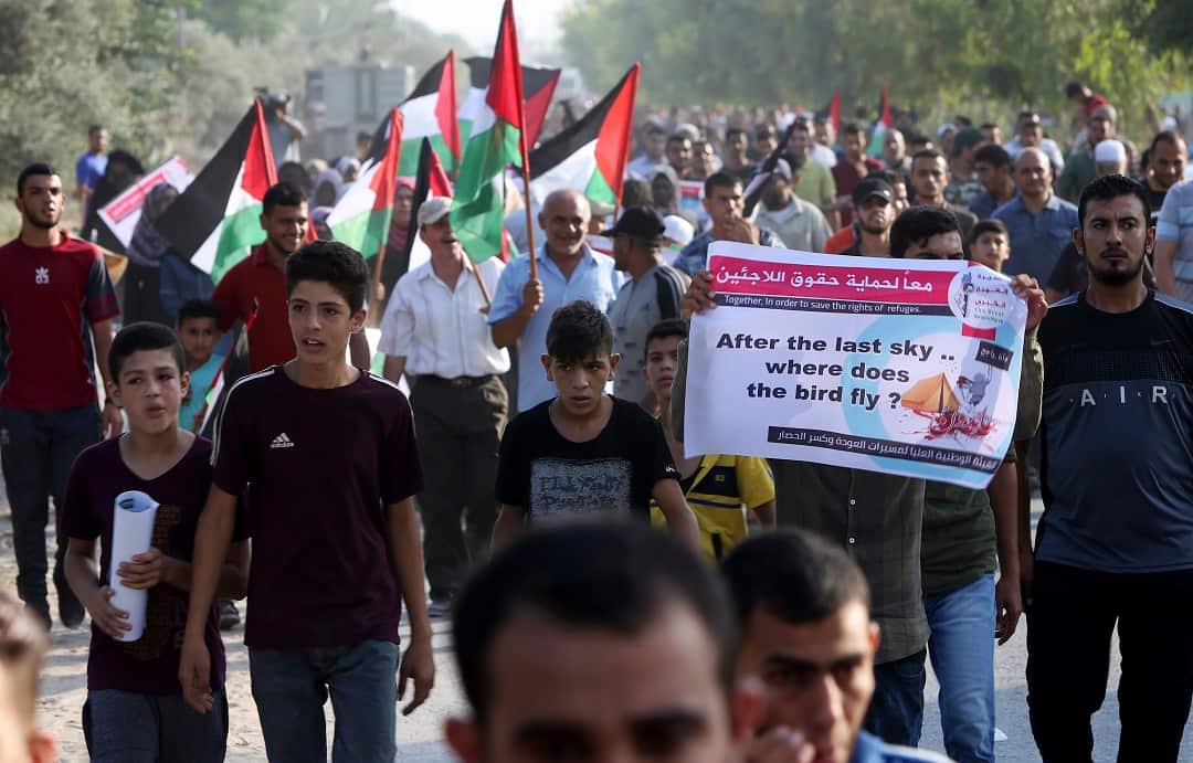 Protesters march during a protest at the Palestinians side of the Erez border crossing on Tuesday. 