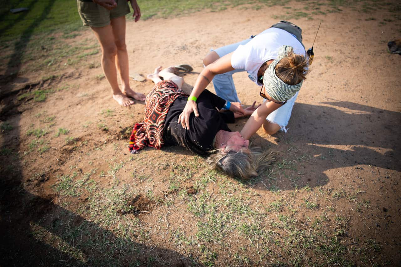 A man has been arrested after he allegedly rode a horse at anti-Adani protesters and knocked over and injured a woman in central Queensland.