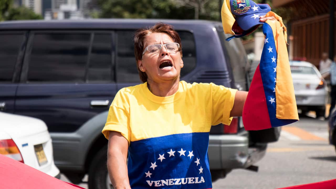 Opposition demonstrators take part in protest against the government of President Nicolas Maduro on 30/1/19.