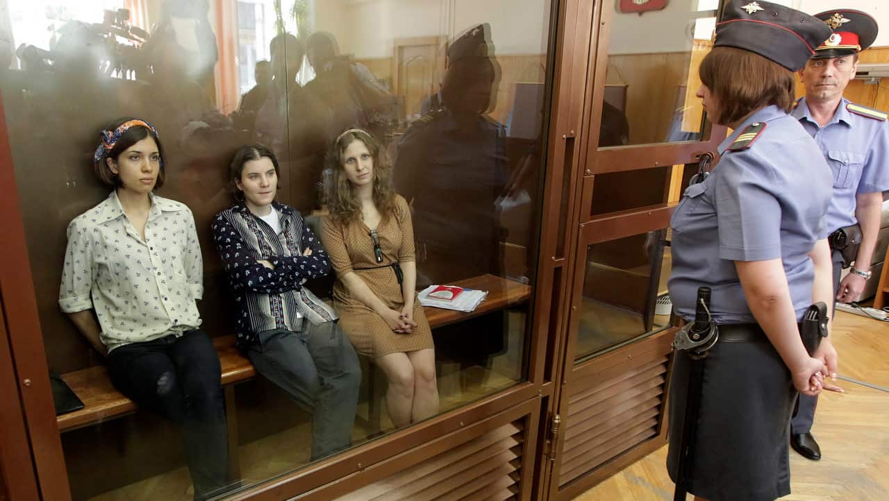 Pussy Riot Nadezhda Tolokonnikova (L), Yekaterina Samutsevich (C) and Maria Aliokhina (R)  face court.