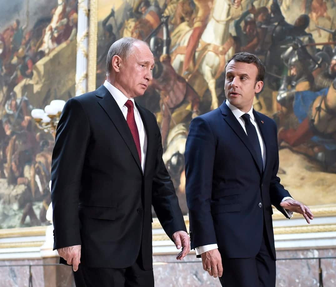 French President Emmanuel Macron (R) and Russian President Vladimir Putin (L) arrive for a joint news conference in May 2017