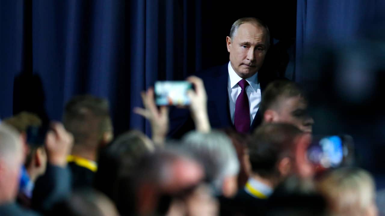Russian President Vladimir Putin arrives for his annual news conference in Moscow, Russia.