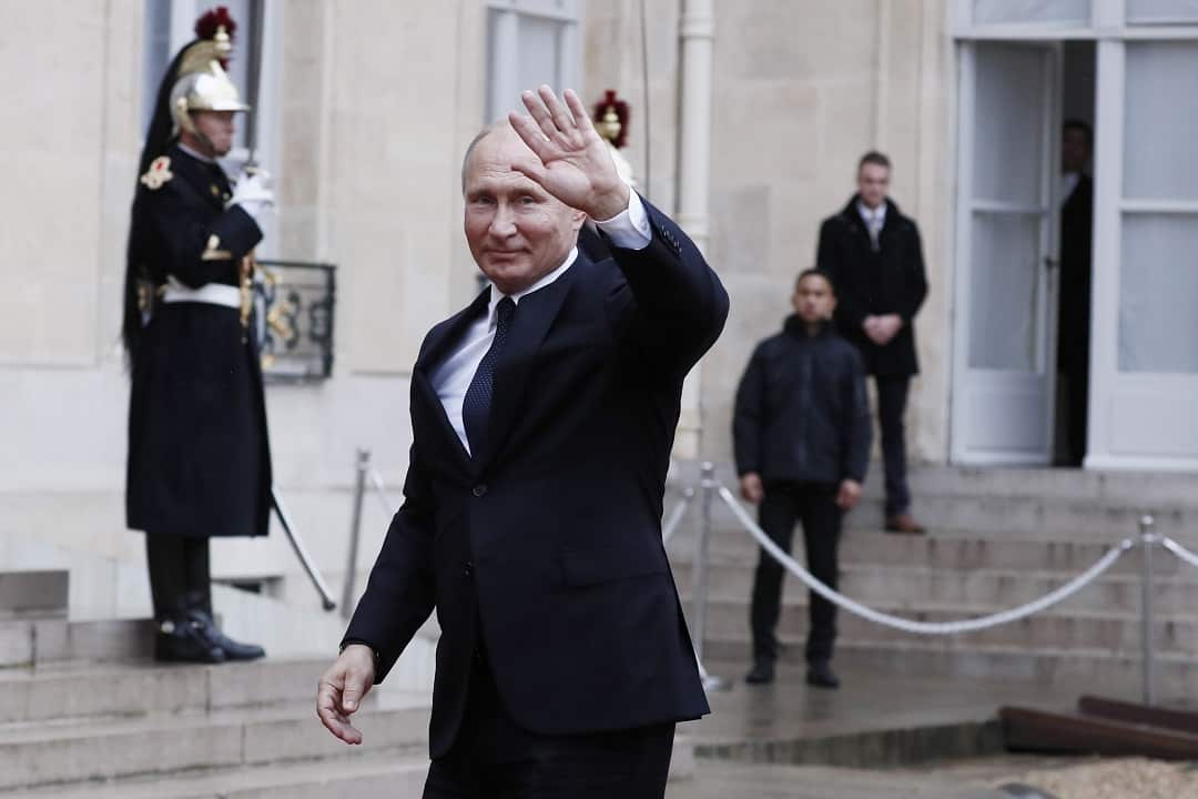 Russian President Vladimir Putin waving