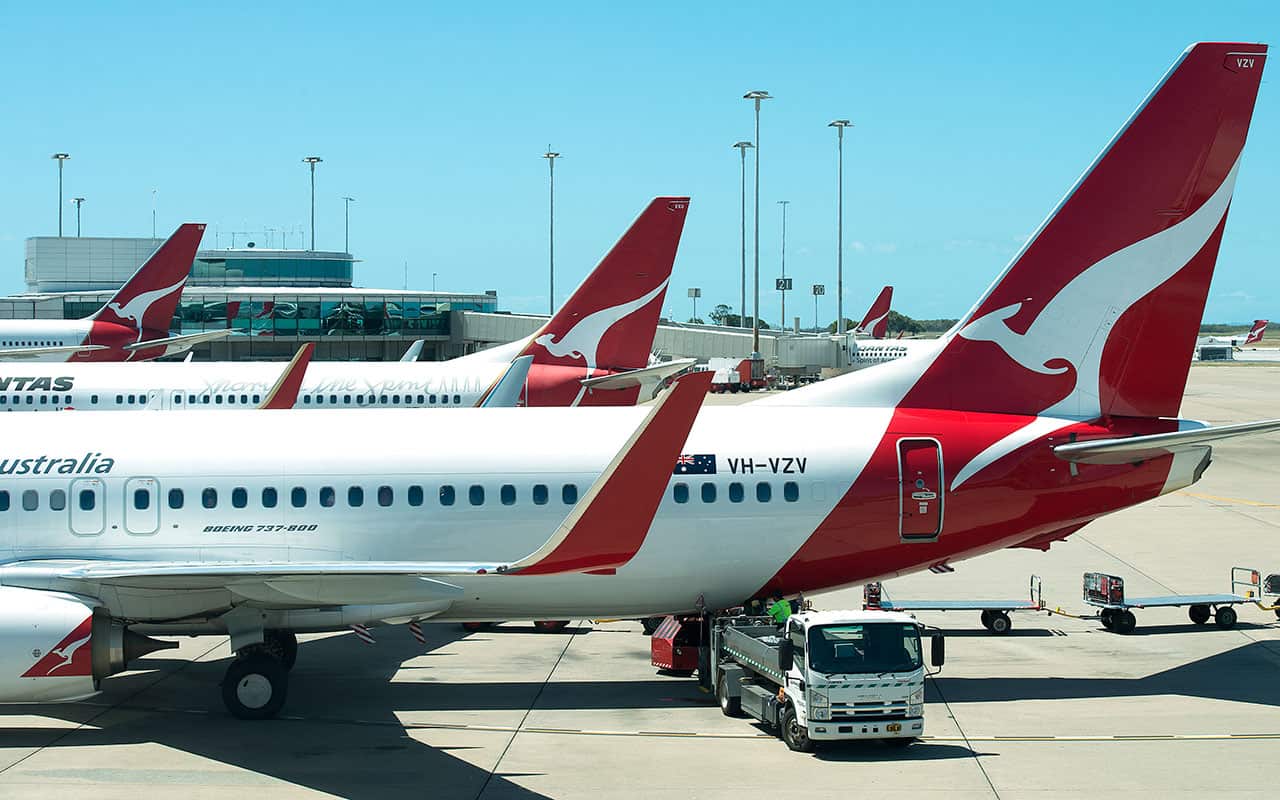Qantas aircraft parked at a terminal.