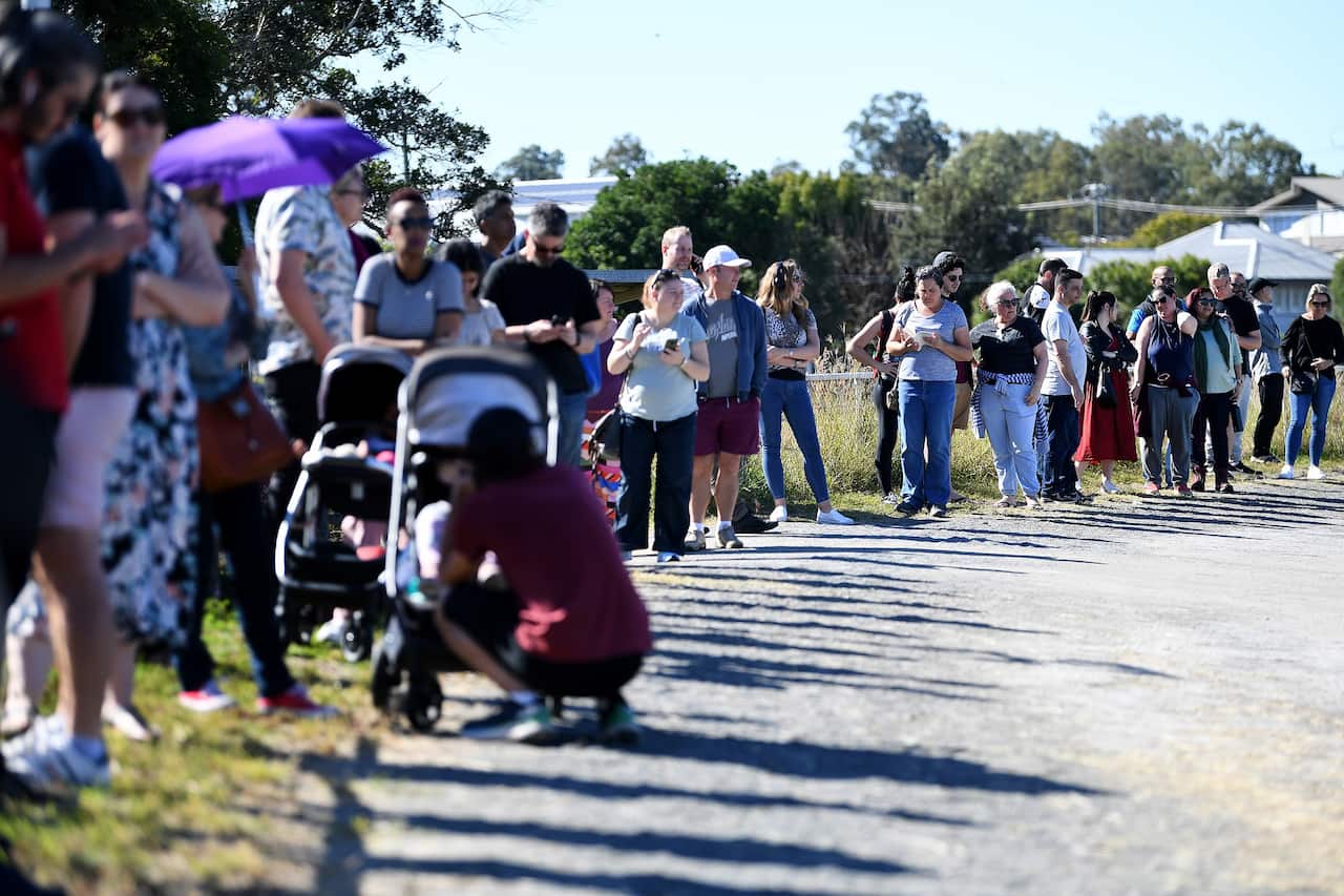 People line up to receive a coronavirus vaccination at the Rocklea Showgrounds in Brisbane on 5 June 2021.