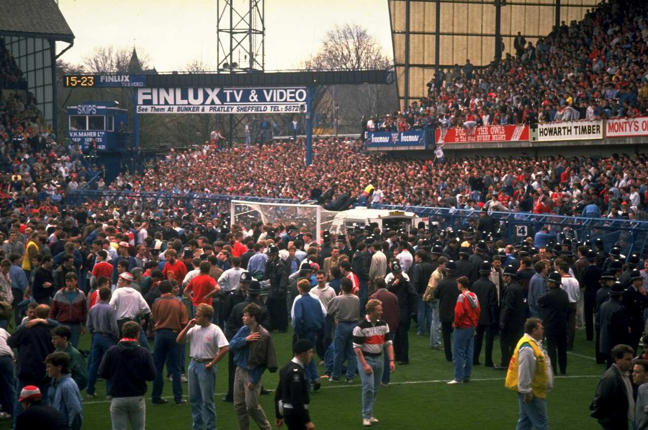 Supporters came onto the field following the disaster (Getty)