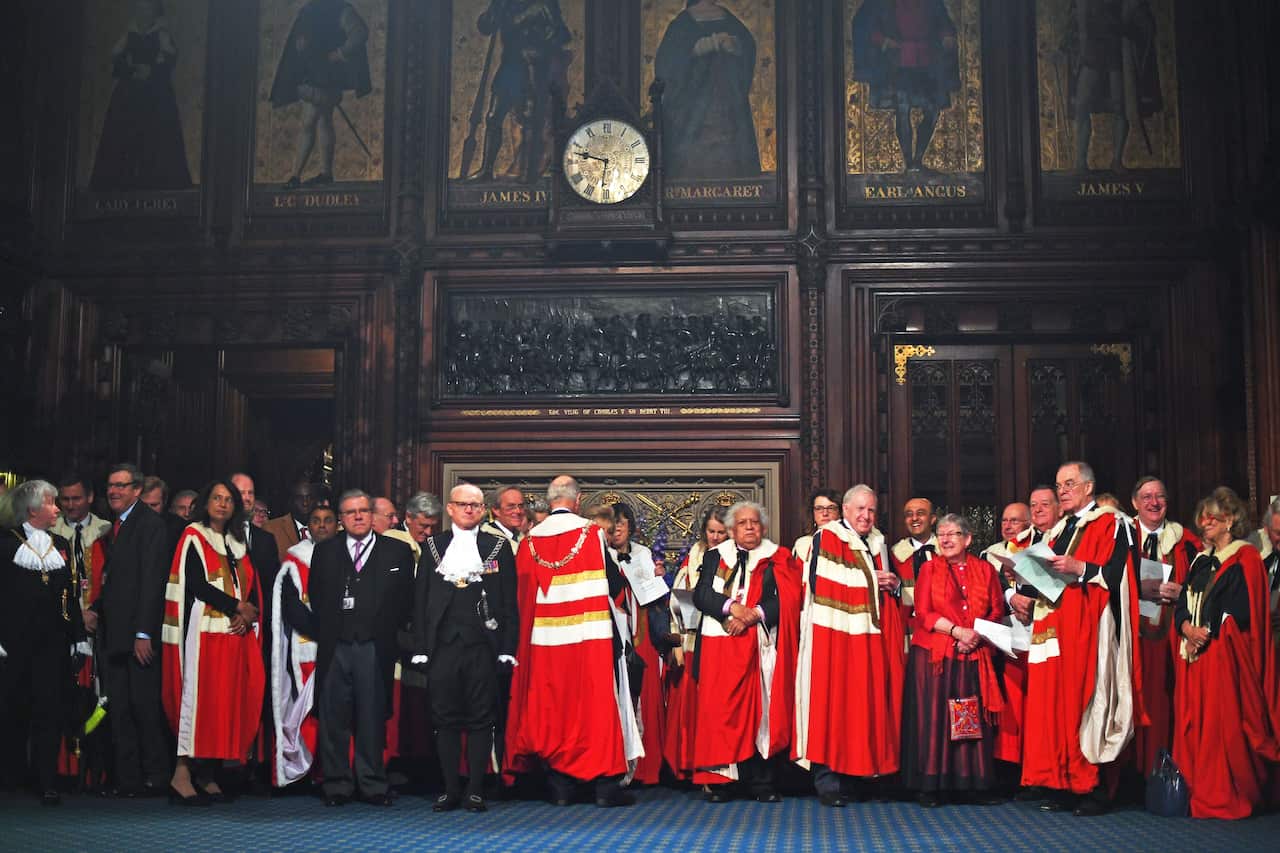 Staff and members of the House of Lords wait ahead of the Queen's Speech. 