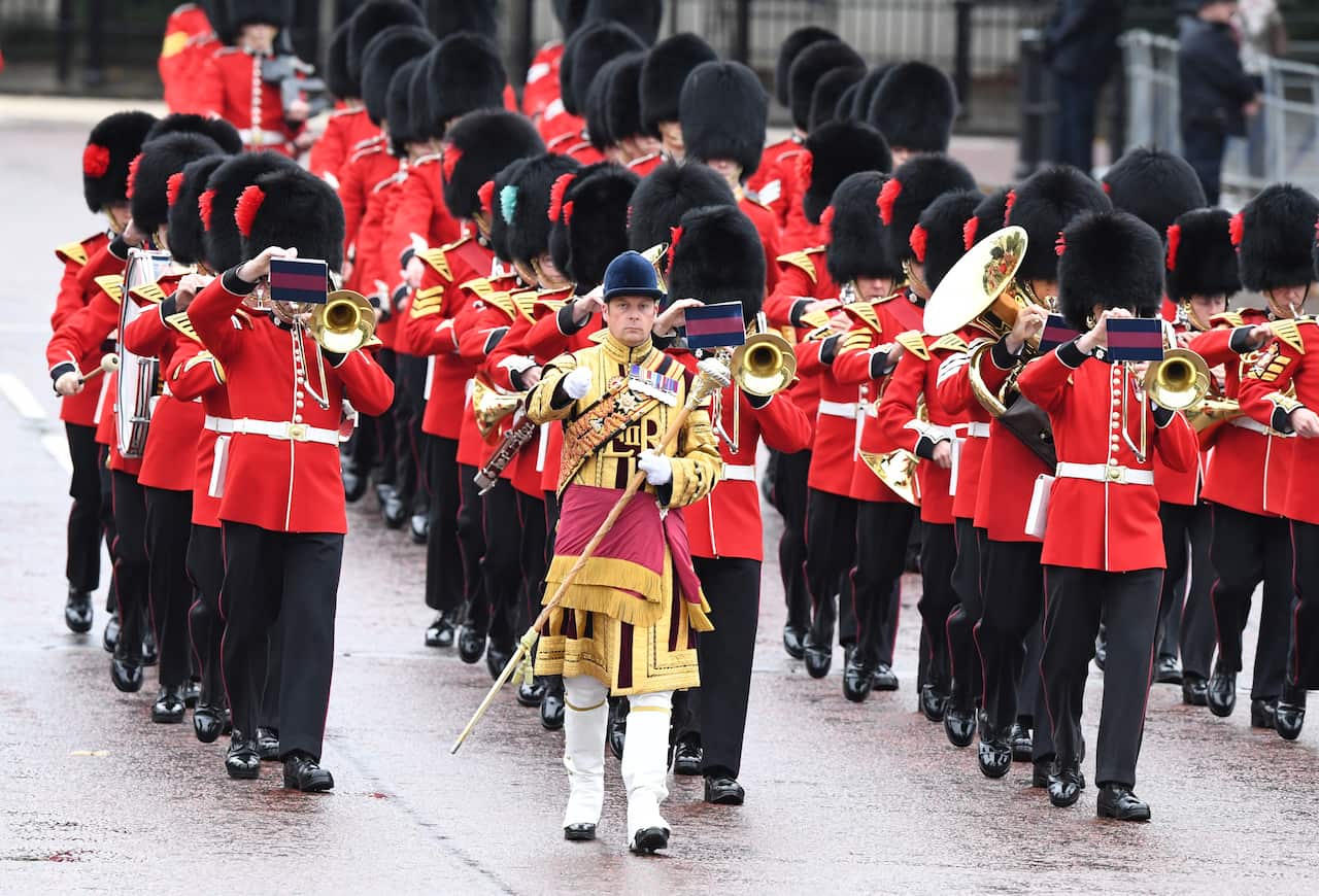 The Queen's guards march in front of Buckingham Palace ahead of the State Opening of Parliament. 