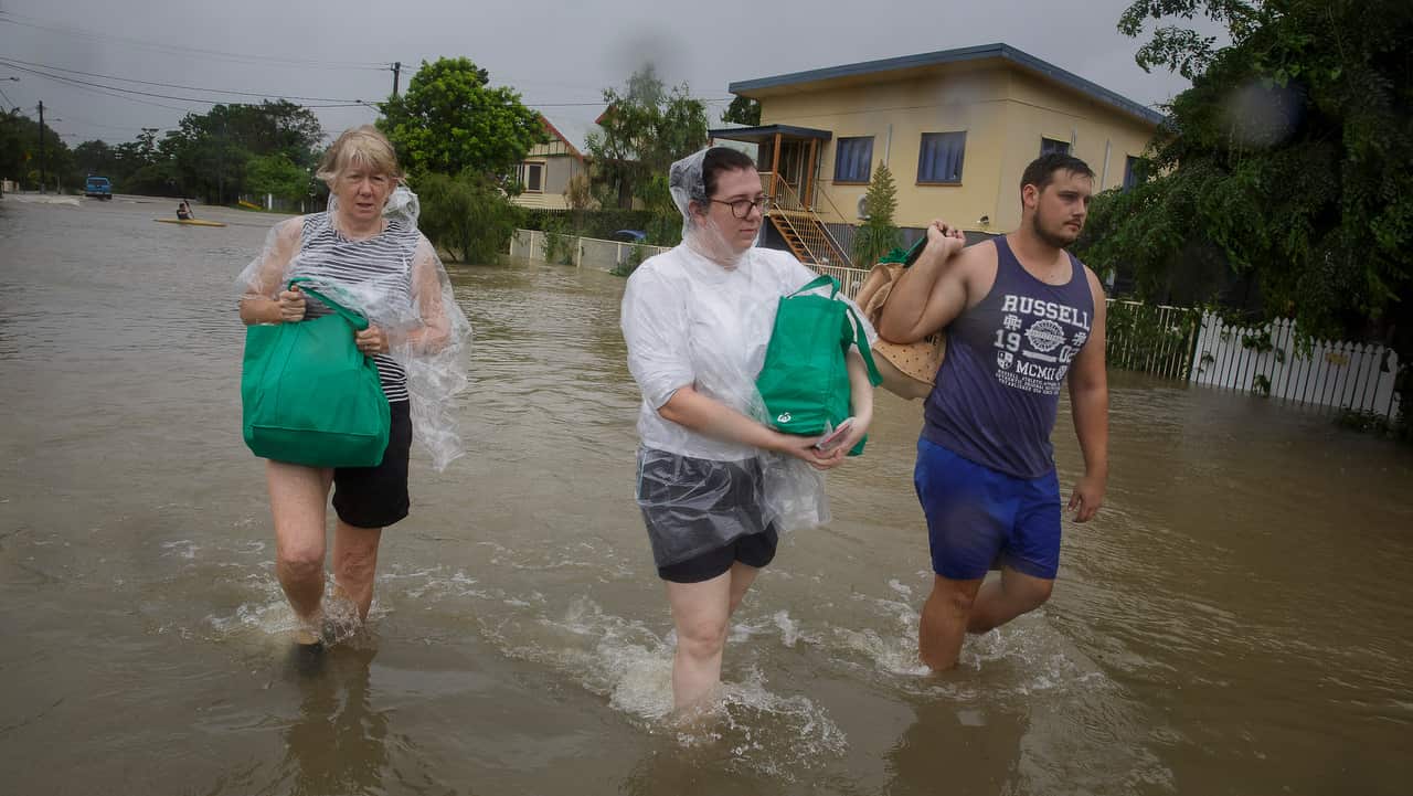 Residents evacuating to higher ground in Hermit Park Townsville on 3/1/19.