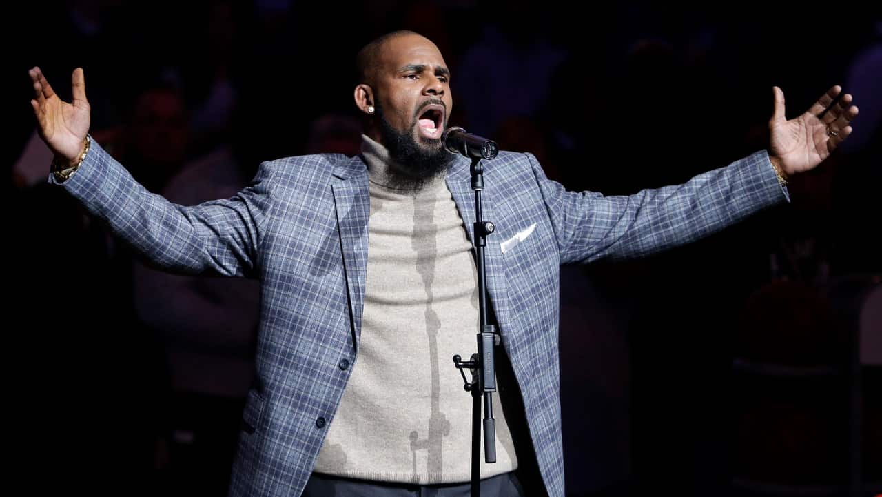 R. Kelly performs the national anthem before an NBA game