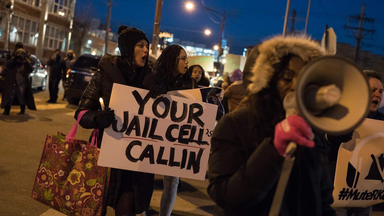 Demonstrators gather near R&B singer R. Kellys former recording studio in Chicago on 9/1/19.