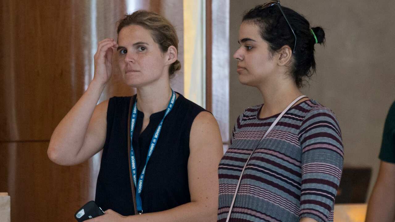 Rahaf Mohammed al-Qunun walking with an unidentified companion  in Bangkok, Thailand.