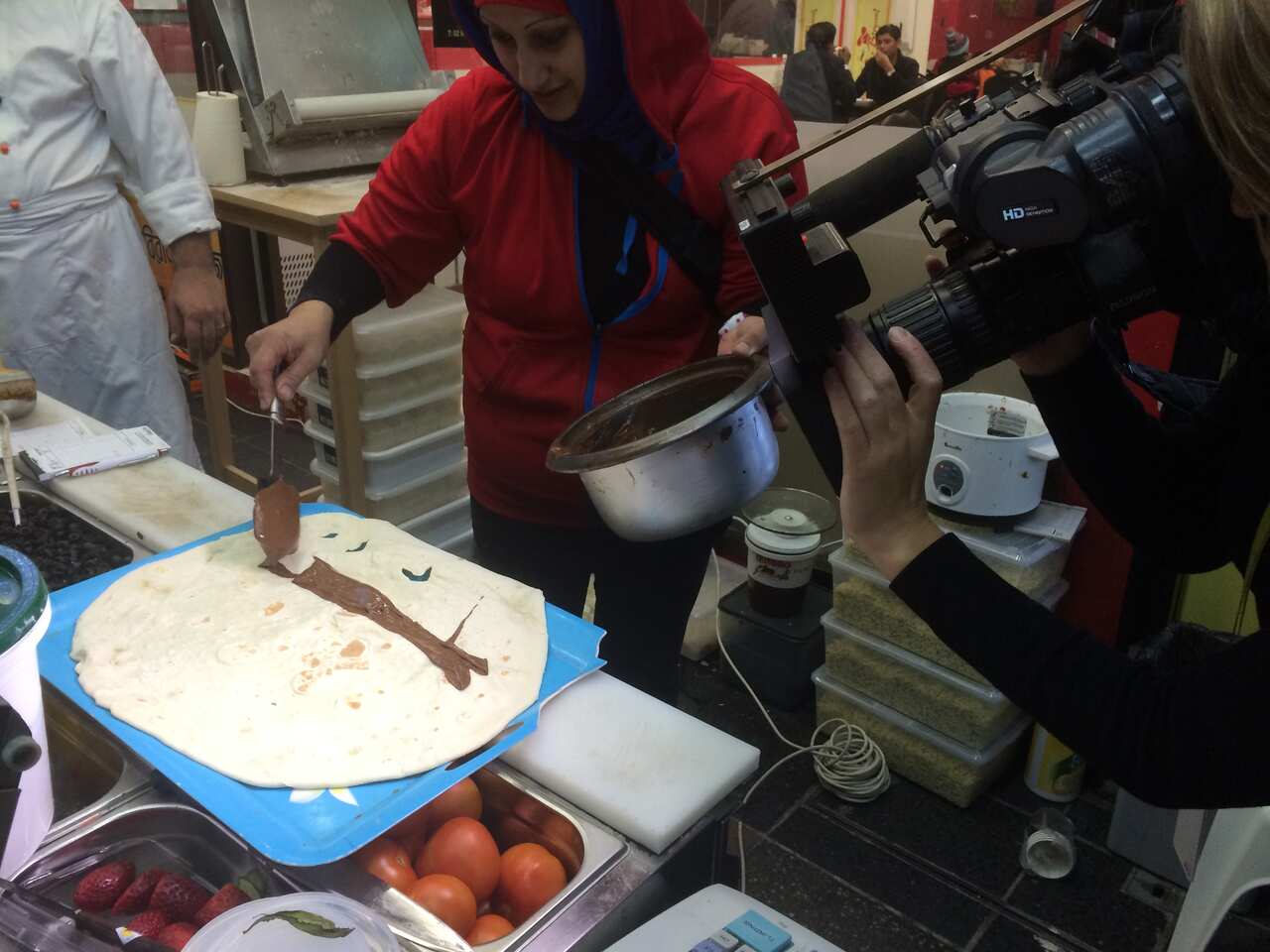 Putting Nutella on Saj bread (SBS)