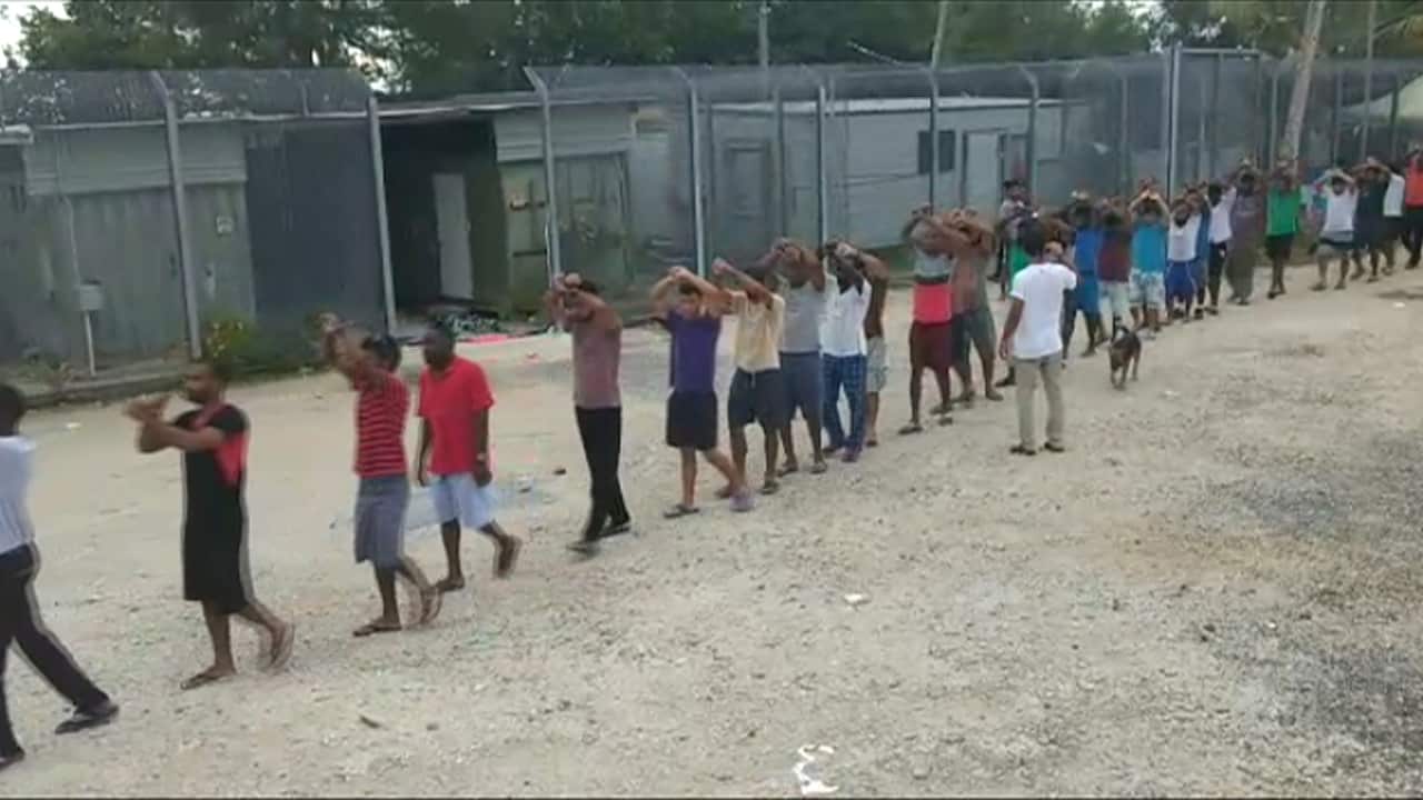 About 400 men remain in the former detention centre and refuse to leave more than two weeks after power, water and food were stopped.