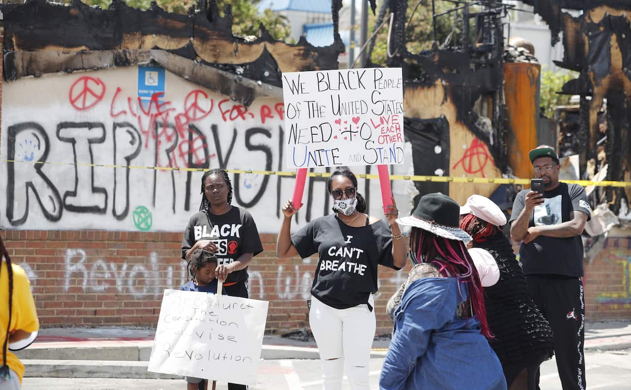 Protesters outside the Wendy's restaurant where Rayshard Brooks was killed by police on 12 June.