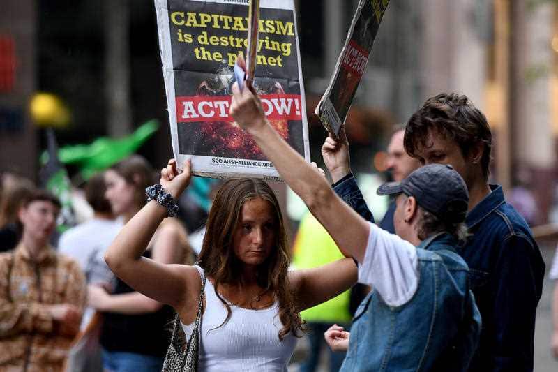 Protesters block off Martin Place in Sydney on Friday. 