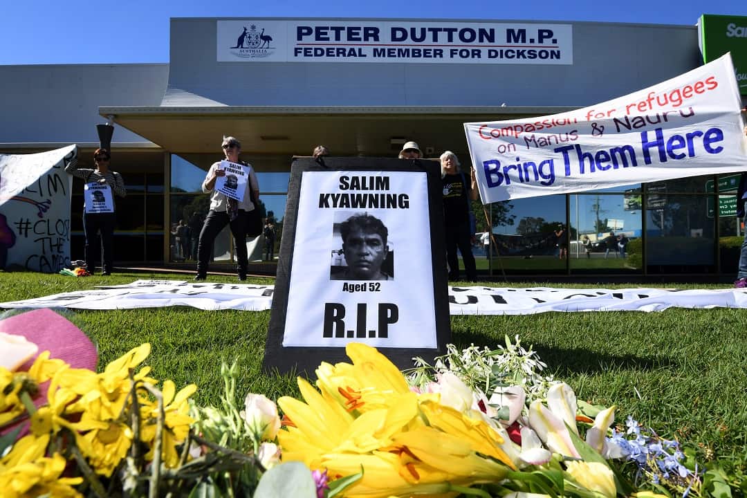 Activists hold a vigil for Salim, a Rohingya refugee from Myanmar who died on Manus Island, in front of Immigration minister Peter Dutton's office in Brisbane.