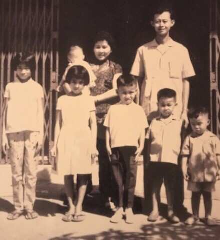 Bill Ngo as a young child (second from right) with his family in Cambodia.