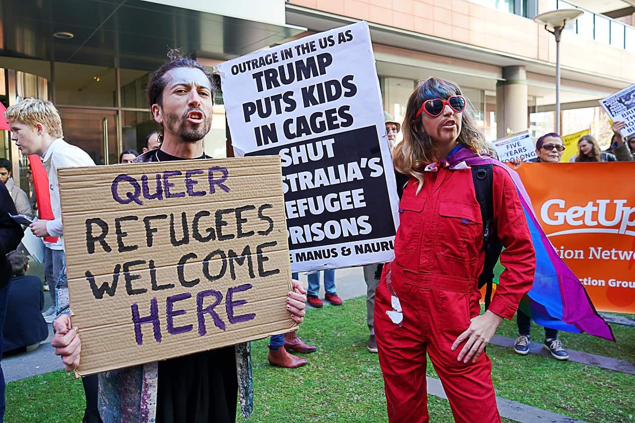 Rally-goers protest during the Evacuate Manus and Nauru Protest - 'Five Years Too Long, 12 Deaths Too Many' Protest at Town Hall in Sydney.
