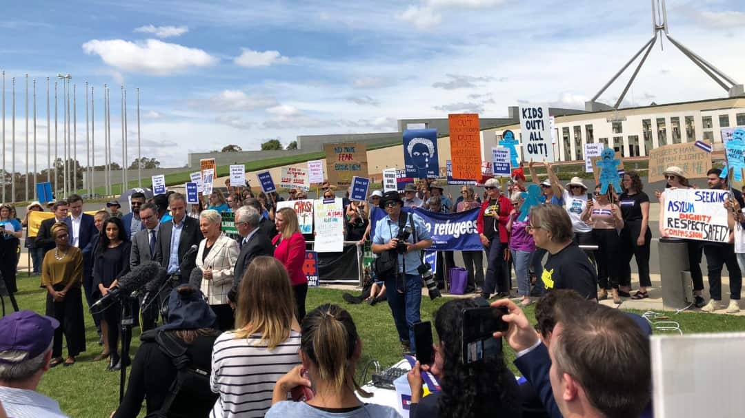 Refugee advocates and supporters outside Parliament House in Canberra.