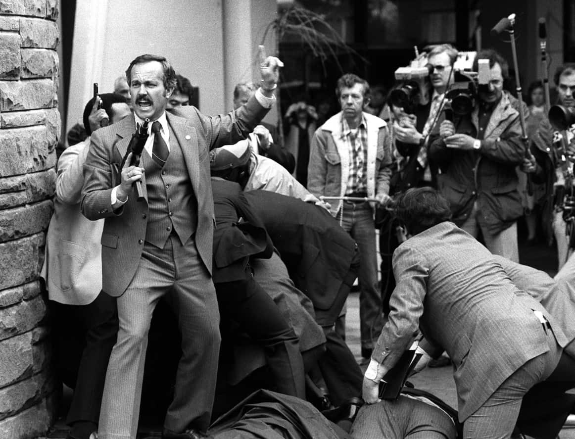 John Hinckley is wrestled to the ground in this March 30, 1981 file photo (AAP)