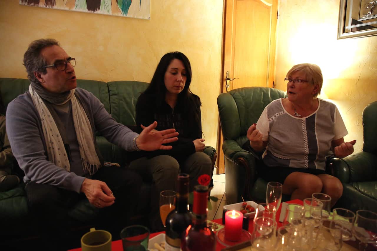 Antonio (L) and Regine argue about politics.