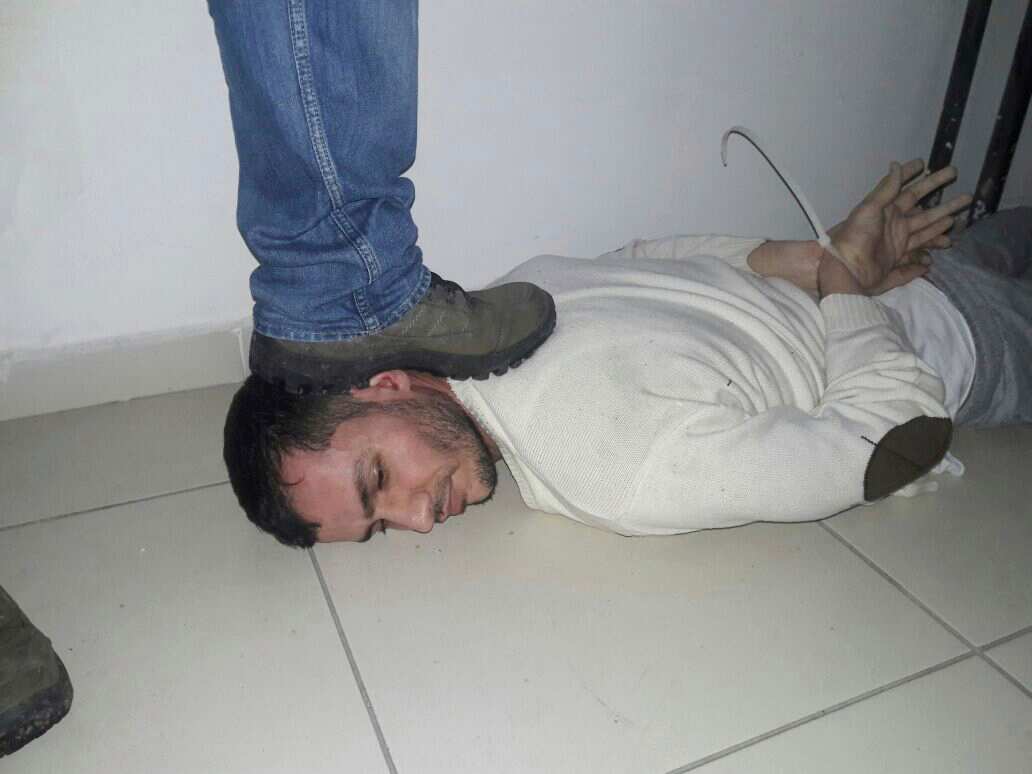 An unidentified man is subdued, detained during a police operation to capture Reina club attacker, in Istanbul, Turkey, late Monday, Jan. 16, 2017