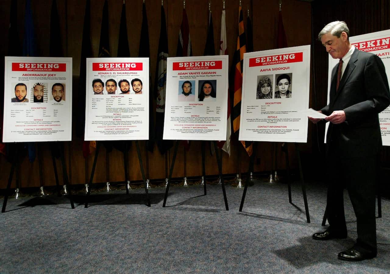 FILE -- Robert Mueller, the FBI director, during a news conference at the FBI headquarters in Washington, May 26, 2004. 