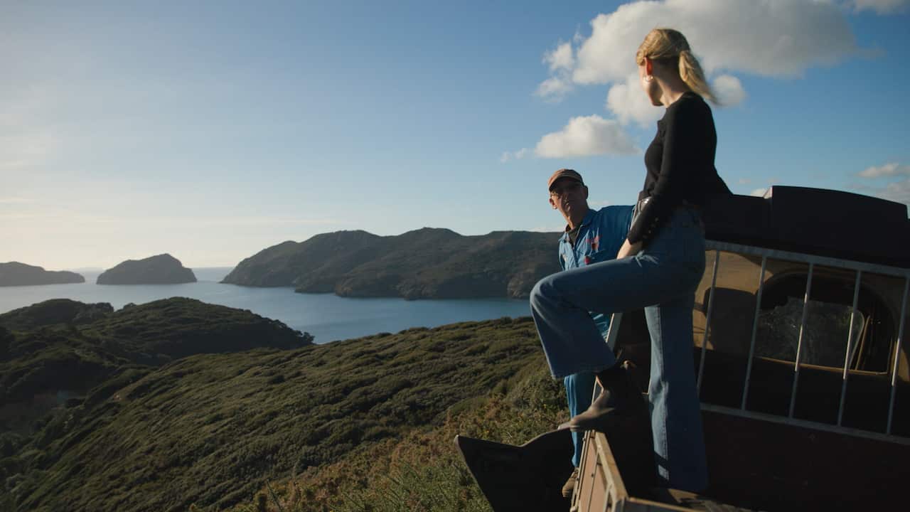 Reporter Calliste Weitenberg with longterm Great Barrier Island local Sven Stellin, at one of the look outs of his off grid property. 