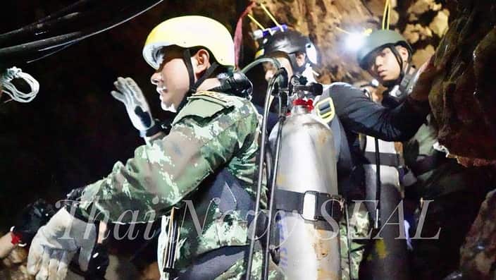 Thai Navy officer and rescuers work inside a cave complex during the ongoing rescue operations for the child soccer team and their assistant coach.