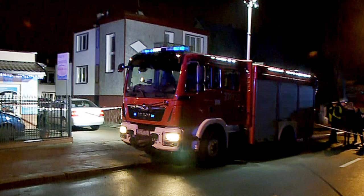 A fire engine before an "Escape Room" game house where a fire killed five teenage girls celebrating one of their birthdays and injured a man in Koszalin.