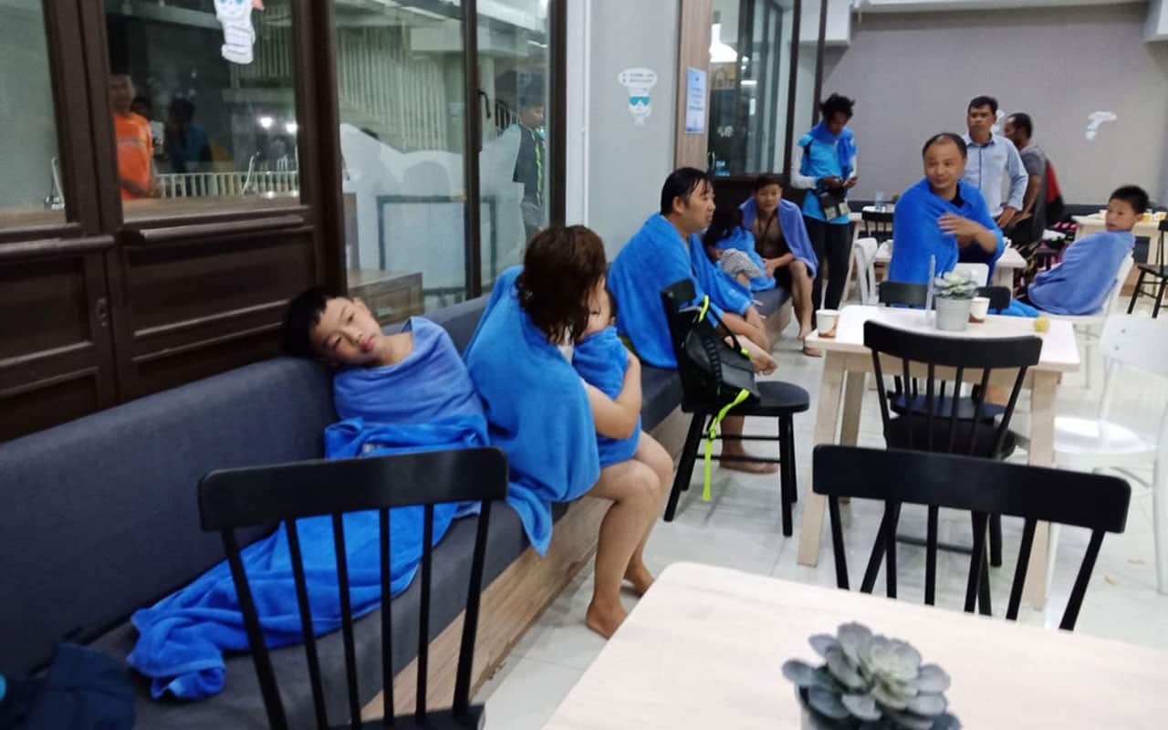 Rescued passengers of capsized tourist boat rest at a port facility in Phuket on July 5, 2018.