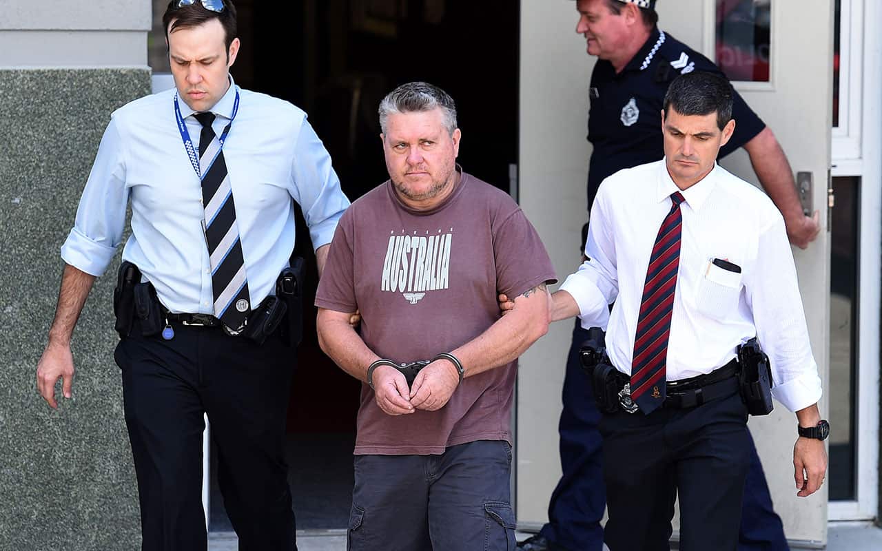 A September 20, 2016 file photo of Rick Thorburn being escorted by police from the Logan Central Police Station, Queensland.