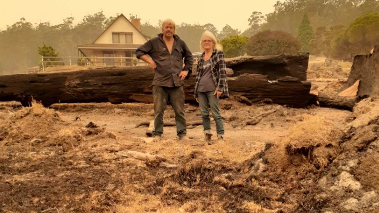 The de Gues family on their scorched farm. 