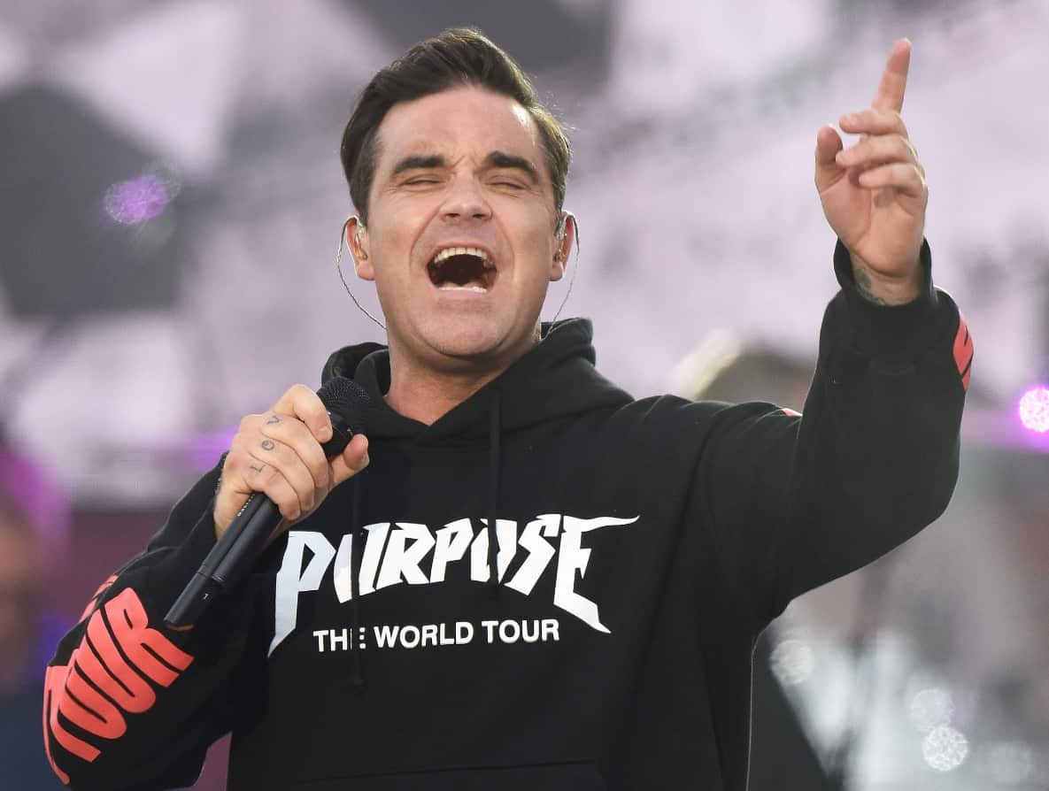 In this Sunday, June 4, 2017, handout photo provided by Dave Hogan for One Love Manchester, singer Robbie Williams (AAP)