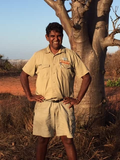 Bush food entrepreneur Robert Dann beside a boab tree near Broome, WA.