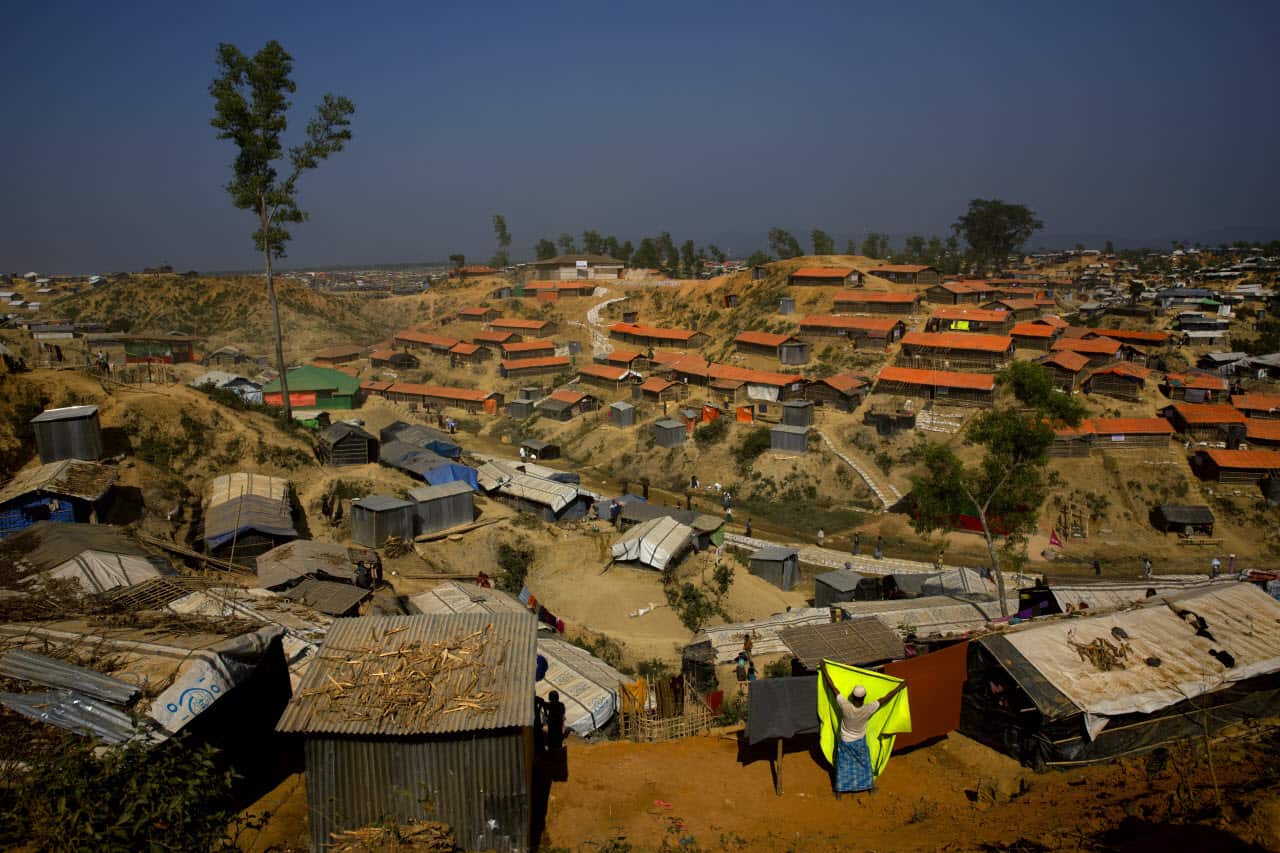 A Rohingya refugee puts up a blanket for drying at Balukhali refugee camp 50 kilometres (32 miles) from, Cox's Bazar, Bangladesh Tuesday, Jan. 23, 2018.