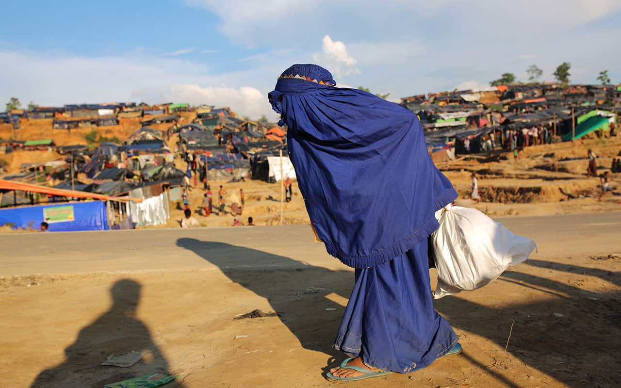 A veiled Rohingya woman walks at Palangkhali refugee camp in Cox's Bazar, Bangladesh, Wednesday, Oct. 4, 2017.