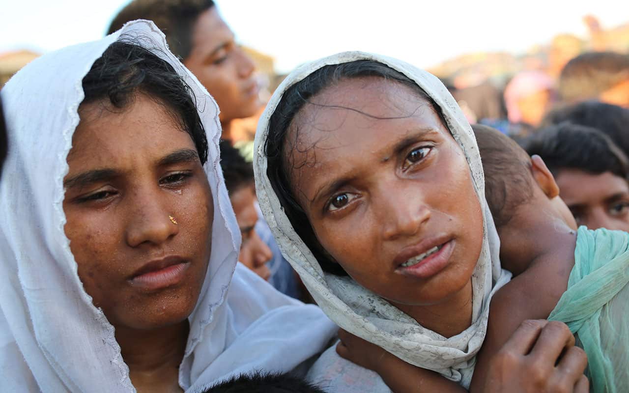 Rohingya women stand in a queue to have their children medically examined at Palangkhali refugee camp in Cox's Bazar, Bangladesh, Wednesday, Oct. 4, 2017.