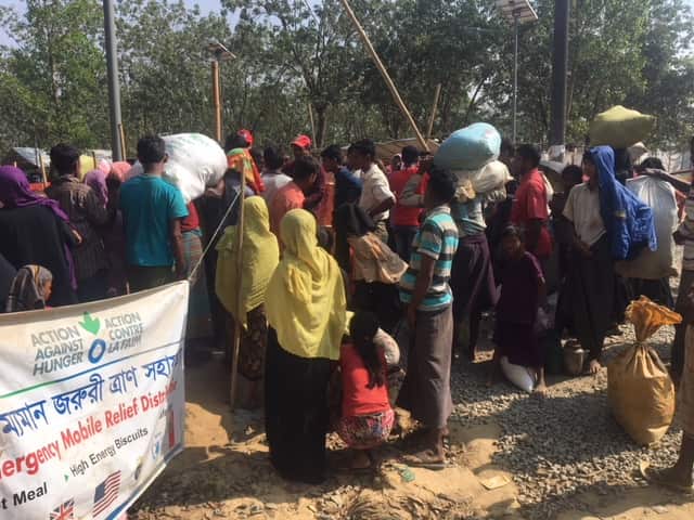 Rohingya Muslims arrive in hundreds to the transit centre set up at Bangladesh. 