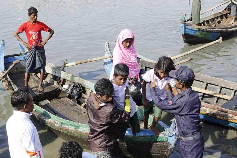 Rohingya Muslims arrive to the Thae Chaung village in Sittwe, Rakhine State, Western Myanmar. The military has seized vessels carrying Rohingya.The military has seized vessels carrying Rohingya.