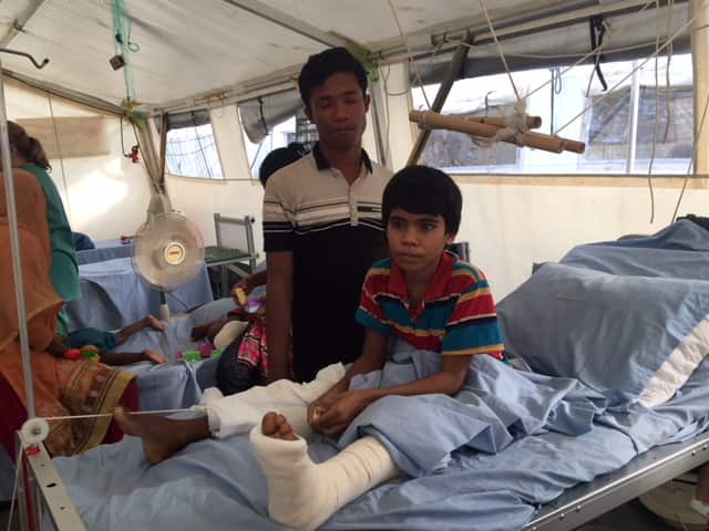 Nur Hashim, nine, with his 18-year-old brother, Abdul Hafez.