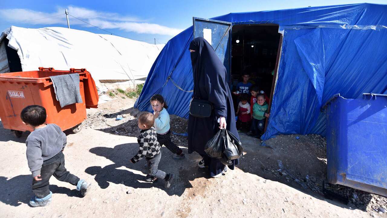 Women and children in a Syrian refugee camp.