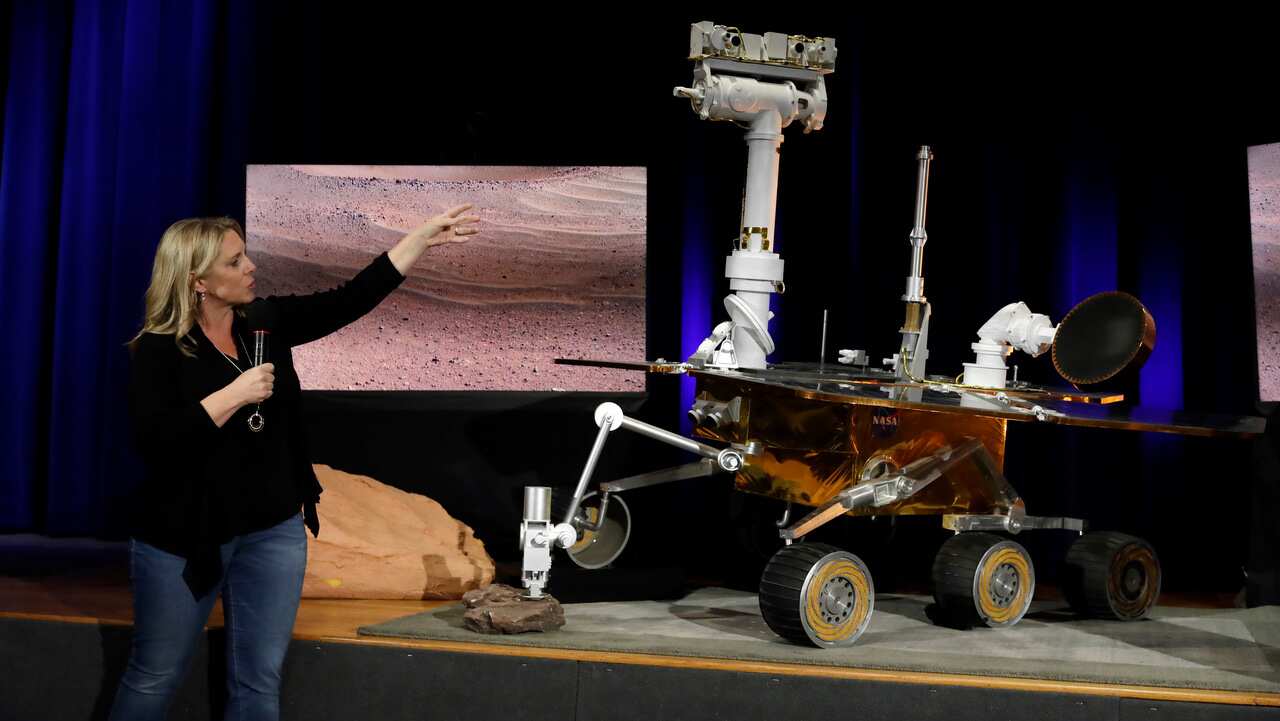 Mars 2020 project system engineer Jennifer Trosper, left, points to a replica of the Mars Exploration Rover Opportunity on 13/2/19.