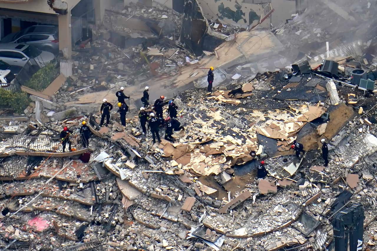 Rescue workers search in the rubble at the Champlain Towers South Condo.