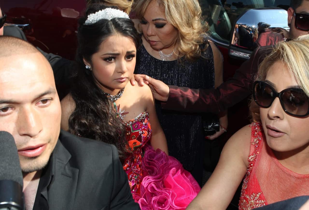 Mexican teenager Rubi (C) arrives to her 15th birthday party in La Joya, Mexico, 26 December 2016. (AAP)
